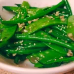 Crunchy green bean, mangetout, and garlic stir fry